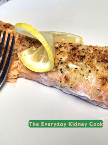 Garlic Parmesan salmon with twisted lemon slice